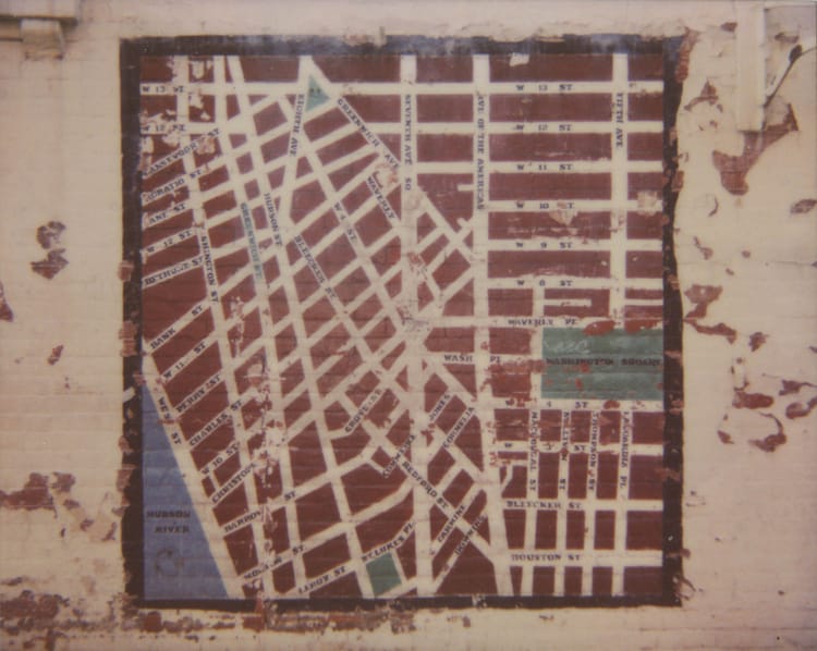 photograph, made with a polaroid spectra, of street art on a wall in the west village of new york city. the mural is on a cre